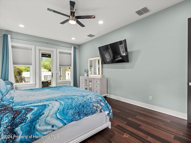 bedroom featuring ceiling fan, dark hardwood / wood-style flooring, and access to outside