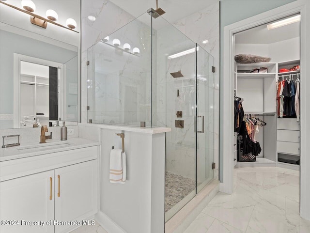 bathroom featuring vanity and a shower with shower door