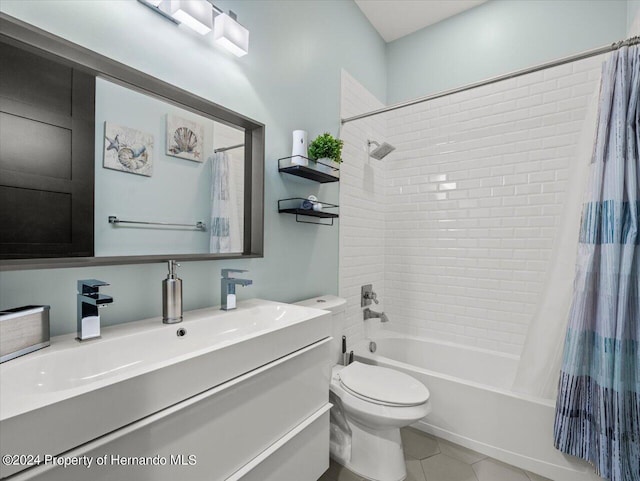 full bathroom featuring tile patterned floors, vanity, shower / tub combo, and toilet