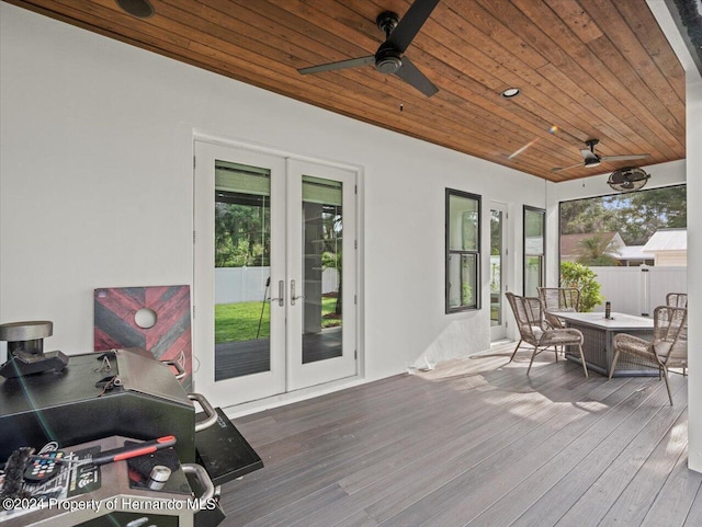 deck featuring ceiling fan and french doors