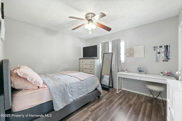 bedroom featuring a textured ceiling, dark hardwood / wood-style flooring, and ceiling fan