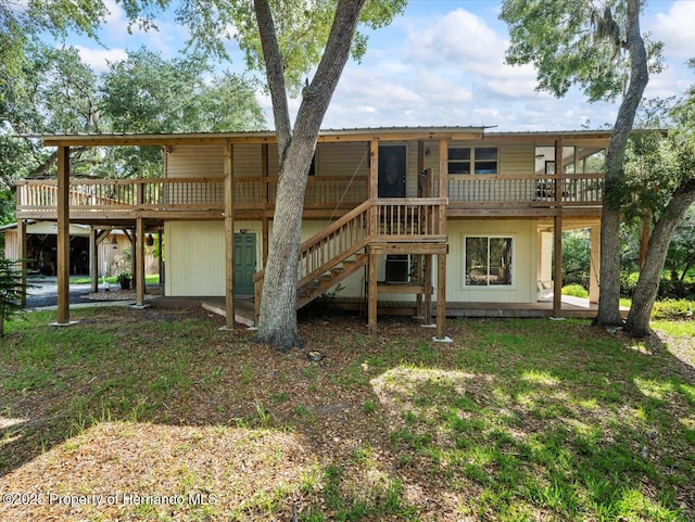 rear view of house featuring a deck