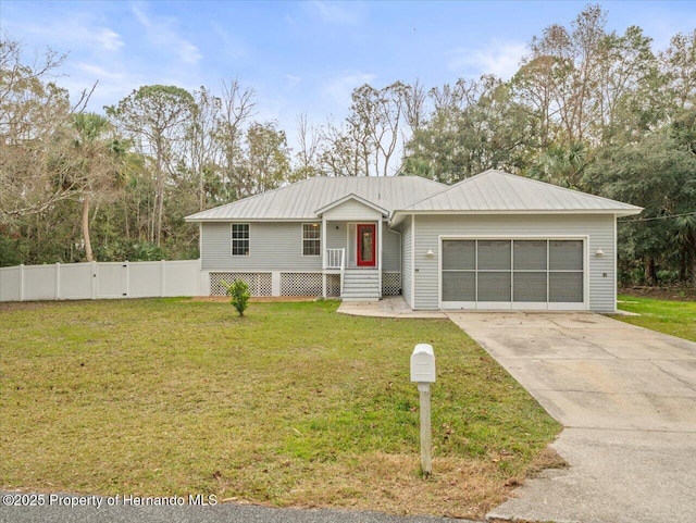 single story home with a garage and a front lawn