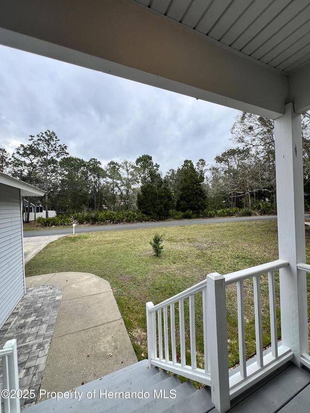 view of yard with covered porch