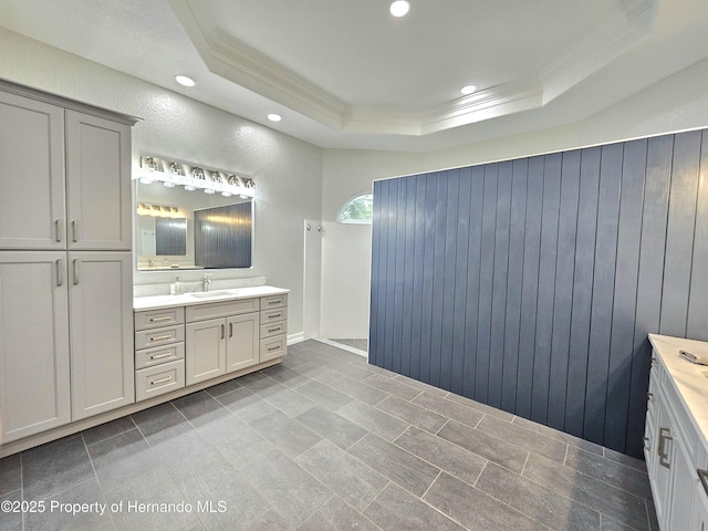 bathroom with vanity, crown molding, and a tray ceiling