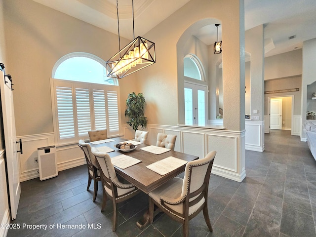 dining room with a barn door