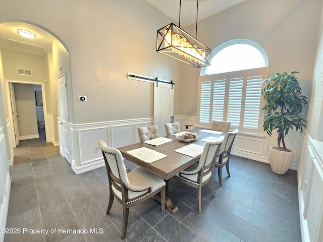 dining area featuring a barn door