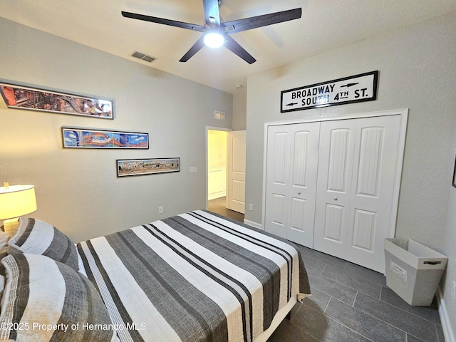 tiled bedroom featuring a closet and ceiling fan