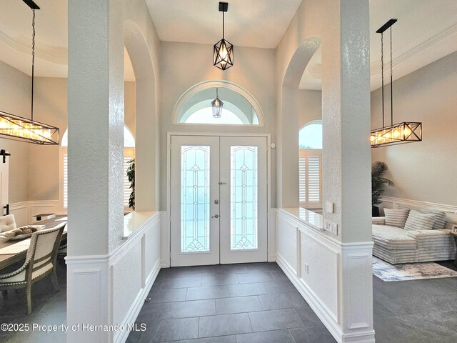 tiled foyer entrance featuring french doors