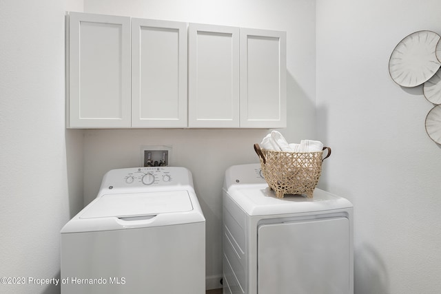 laundry room featuring cabinets and independent washer and dryer