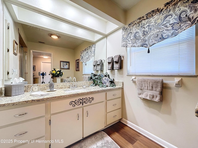 bathroom featuring vanity and hardwood / wood-style floors