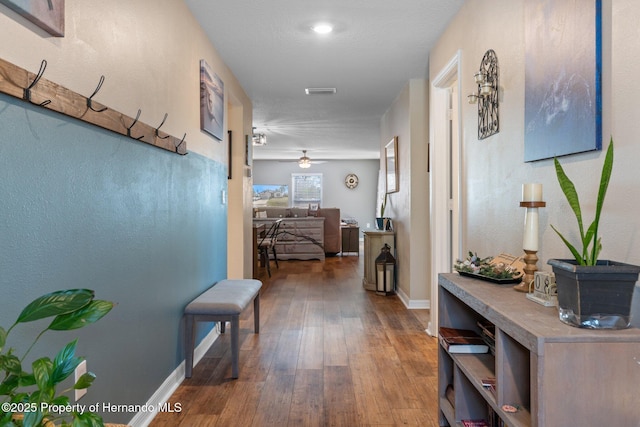 hallway with wood-type flooring