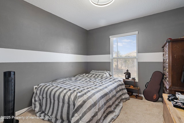 bedroom with light colored carpet