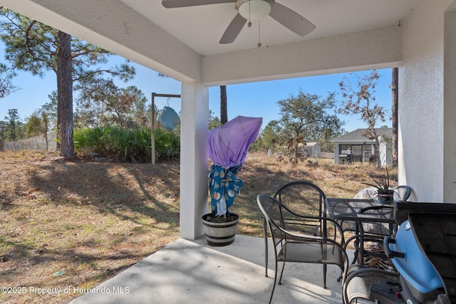 view of patio featuring ceiling fan