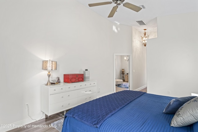 bedroom featuring ceiling fan and dark wood-type flooring