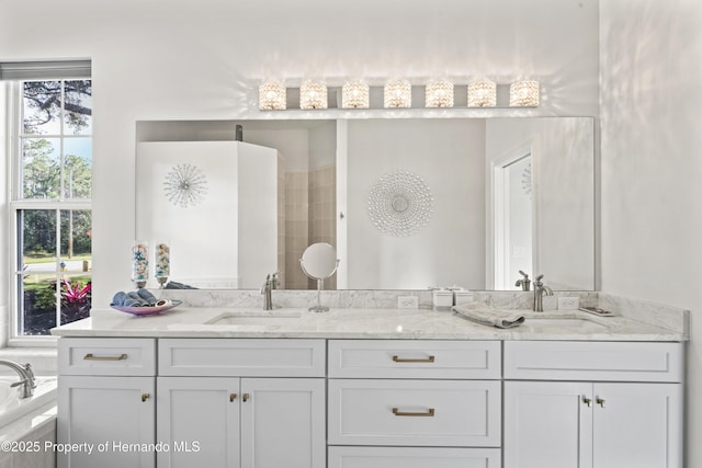 bathroom featuring a bathing tub and vanity