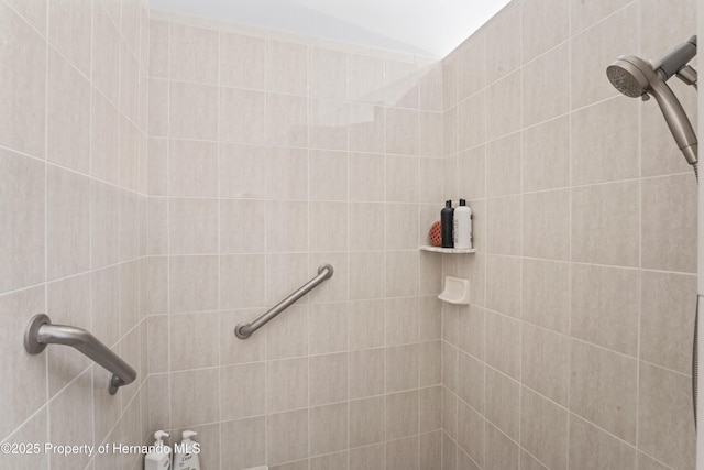 bathroom with tiled shower