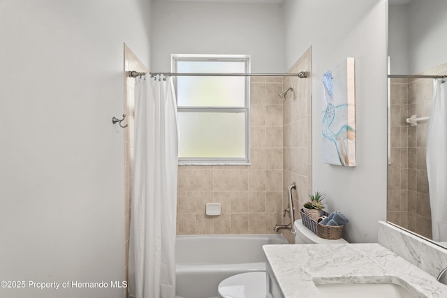 full bathroom featuring shower / bath combo with shower curtain, vanity, and toilet