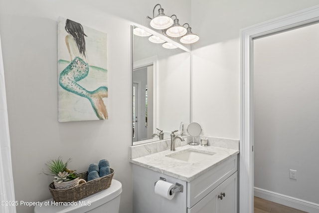 bathroom with vanity and toilet