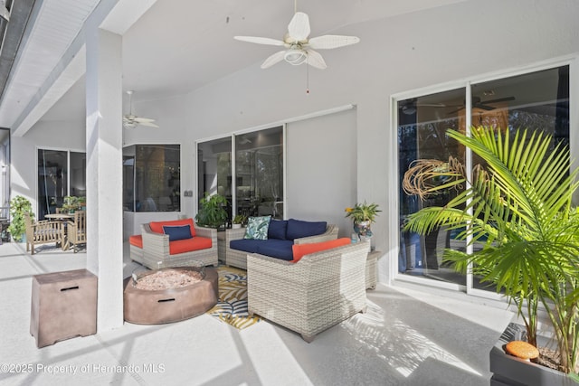 view of patio featuring ceiling fan and an outdoor living space