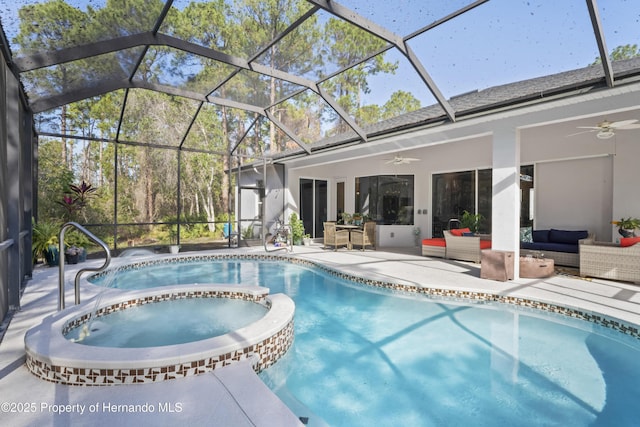 view of pool featuring a lanai, a patio area, ceiling fan, and an outdoor hangout area