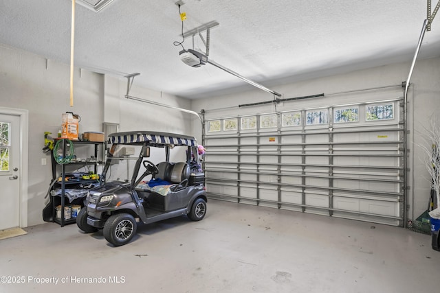 garage featuring a garage door opener