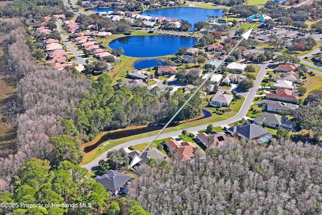 birds eye view of property featuring a water view