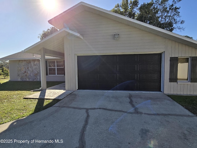 exterior space featuring a yard and a garage