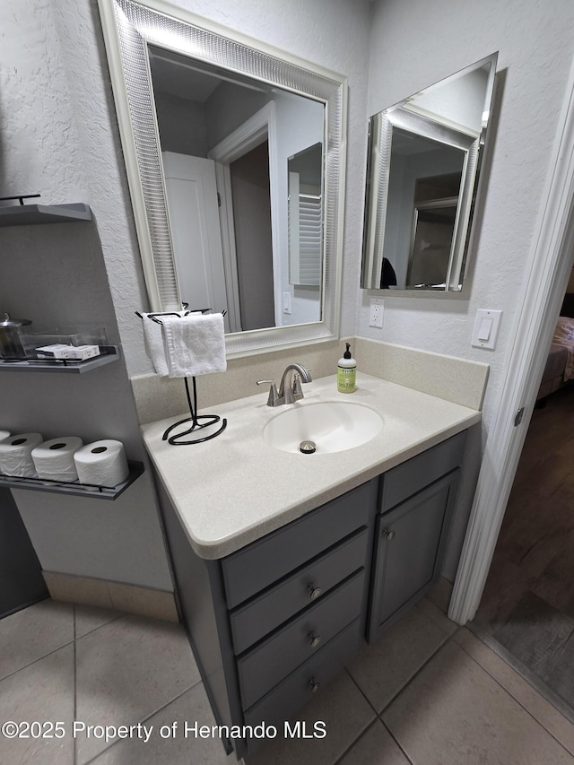 bathroom with vanity and tile patterned floors