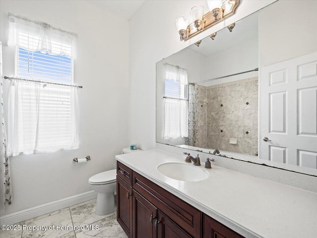 full bathroom with toilet, vanity, baseboards, marble finish floor, and a shower