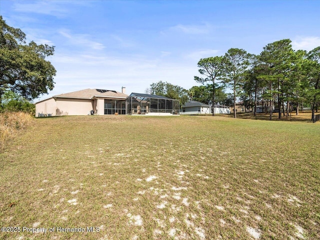 view of front facade with a front yard and a lanai