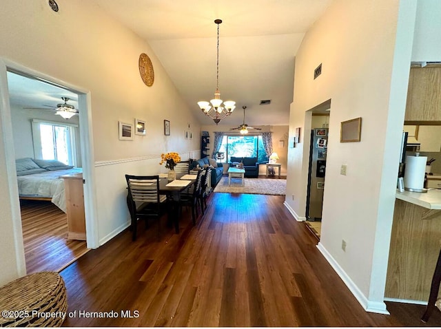 dining area with a wealth of natural light, dark hardwood / wood-style flooring, and high vaulted ceiling