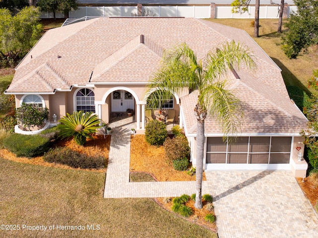 view of front facade with a garage and a front lawn