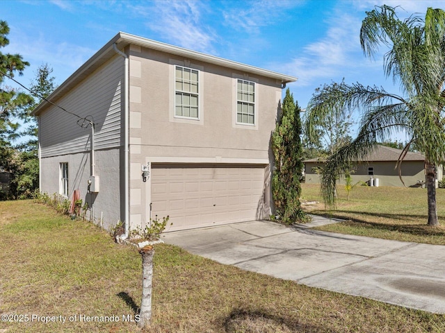 view of front of property featuring a garage and a front yard