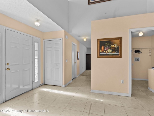 entrance foyer with light tile patterned flooring