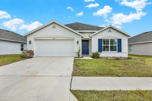 single story home featuring a garage and a front lawn