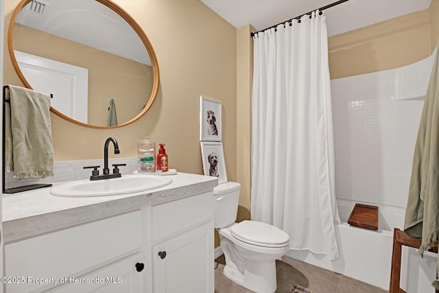 full bathroom with tile patterned flooring, vanity, shower / tub combo, and toilet