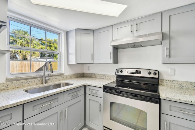 kitchen featuring sink, stainless steel electric range, gray cabinets, and light stone counters