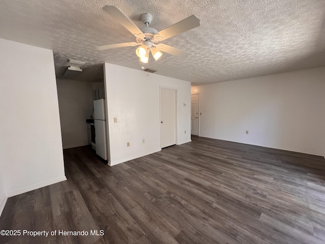 interior space featuring ceiling fan, dark hardwood / wood-style floors, and a textured ceiling