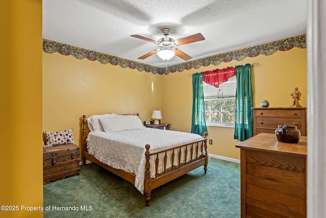 carpeted bedroom with a textured ceiling and ceiling fan