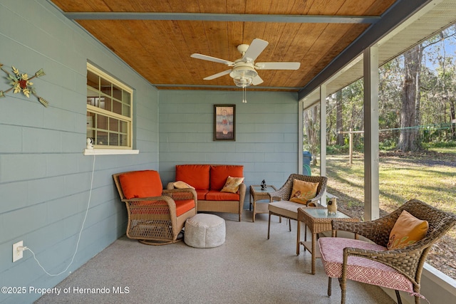 sunroom / solarium with wooden ceiling and ceiling fan