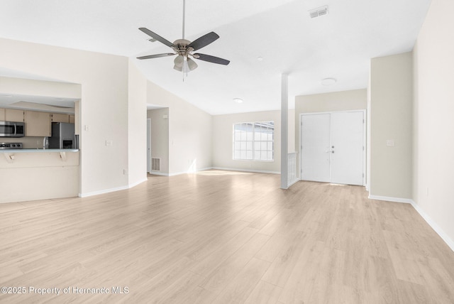 unfurnished living room featuring ceiling fan, vaulted ceiling, and light hardwood / wood-style flooring