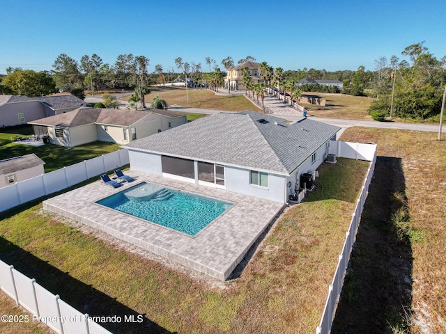 view of swimming pool with a lawn and a patio area