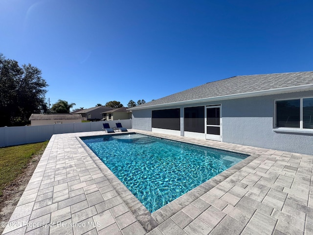 view of swimming pool with a patio area