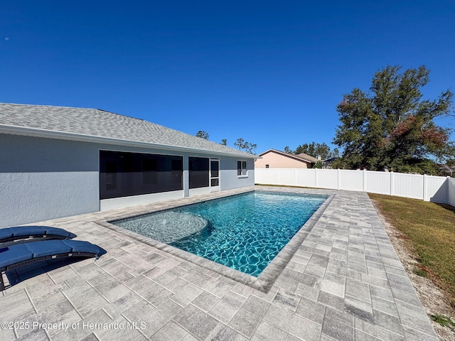 view of swimming pool with a patio