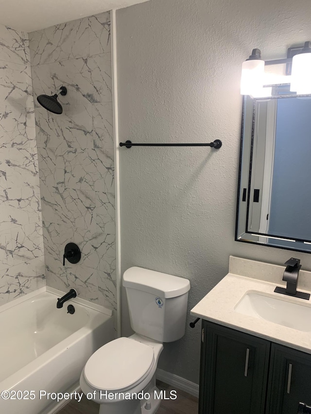 full bathroom with vanity, toilet, and tiled shower / bath