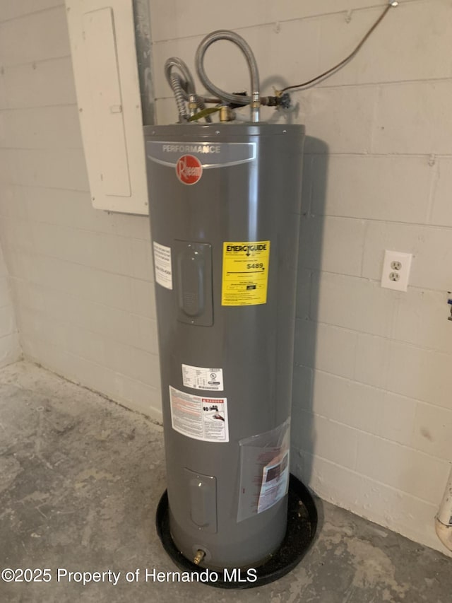 utility room featuring electric water heater and electric panel