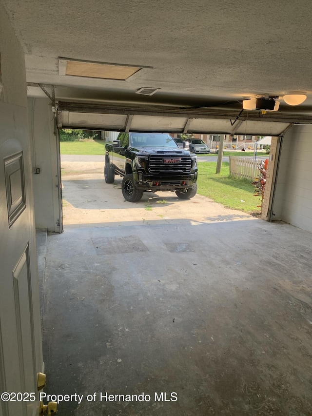 garage featuring a garage door opener