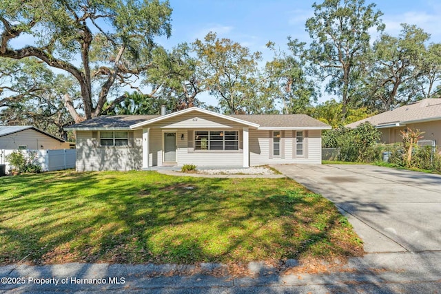 ranch-style house with a porch and a front yard