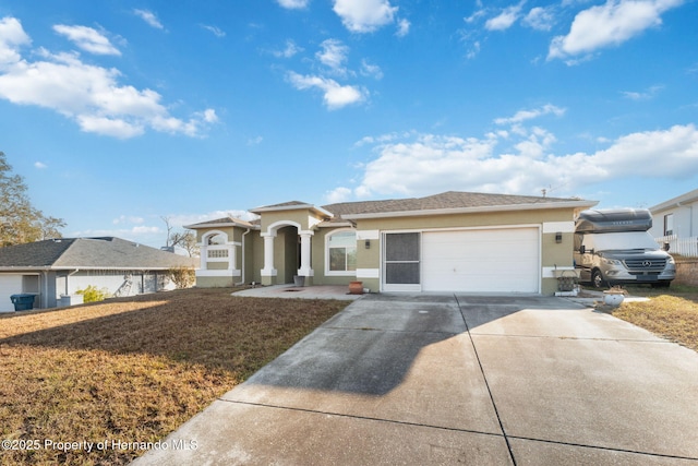 view of front of property with a garage